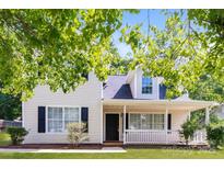 Charming two-story home with covered porch, black shutters, and manicured front yard at 1569 Brentfield Dr, Rock Hill, SC 29732