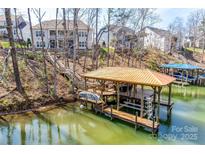 Waterfront property with private dock and boat lift, perfect for lake living and enjoying outdoor recreation at 17927 Culross Ln, Charlotte, NC 28278