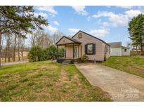 Charming single-story home with a small front porch and a cozy, traditional design at 202 Hovis Rd, Stanley, NC 28164