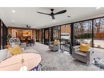 Bright living room featuring modern ceiling fans, floor-to-ceiling windows, and an open layout at 341 Beckwick Ln, Concord, NC 28025