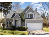 Charming two-story home with well-manicured lawn, two car garage, and inviting curb appeal at 7533 Lady Bank Dr, Charlotte, NC 28269