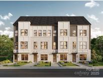 Attractive new construction townhome with white brick, gray siding, and manicured landscaping at Lot 33 Old Pineville Rd, Charlotte, NC 28217