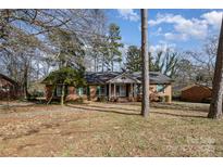 Charming brick home featuring a manicured front yard and classic architectural details at 1120 Crestview Ave, Salisbury, NC 28144