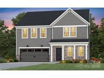 Charming two-story home with a combination of stone and siding, complemented by a well-manicured lawn at 3844 Pee Dee St # 43, Monroe, NC 28110