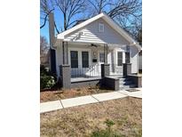 Charming single story home featuring detailed front porch and painted brick accents at 723 S Confederate Ave, Rock Hill, SC 29730
