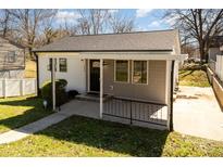 Charming single-story home featuring a covered porch and neutral color scheme at 1009 W 3Rd Ave, Gastonia, NC 28052