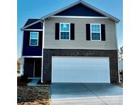 Two-story home featuring a two-car garage and a mix of brick and siding on the facade at 588 N Sparkleberry Ln, Chester, SC 29706