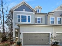 Charming two-story home with attached garage and neutral paint colors at 11005 Cobb Creek Ct, Charlotte, NC 28277