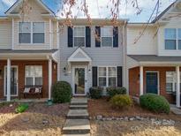 Charming townhome featuring a brick facade, black shutters, and a well-manicured front yard at 1752 Hidden Creek Dr, Rock Hill, SC 29732