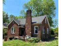 Charming brick home featuring a prominent chimney and inviting front porch, perfect for relaxing outdoors at 107 Lineberger St # 6, Shelby, NC 28150