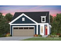 Charming home featuring blue siding, a dormer window and carriage garage doors at 1529 Pebble Shore Ln # 164, Belmont, NC 28012