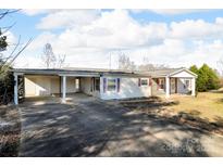 A charming single-story home featuring a covered carport and stone accents at 524 Damascus Church Rd, Statesville, NC 28625
