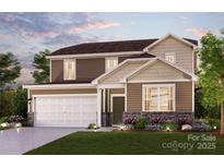 Charming two-story home featuring a two-car garage, stone accents, and a beautifully landscaped front yard at 558 Mountain View Dr, Monroe, NC 28110