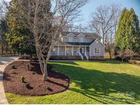 Charming two-story home with a landscaped yard and inviting front porch at 107 Doris Ct, Lincolnton, NC 28092