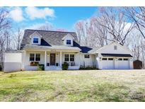 Charming home with a covered front porch, dormer windows and attached two-car garage at 176 Chestnut Ln, Gastonia, NC 28052