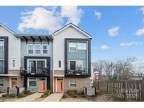 Charming townhouse with a modern exterior and a quaint balcony area at 2132 Electric Ln, Charlotte, NC 28205