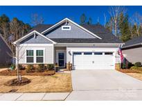 Charming single-story home features a two-car garage and well-maintained landscaping at 7133 Yardley St, Gastonia, NC 28056
