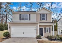 Charming two-story home featuring a two-car garage and welcoming front porch at 2729 Yurman Rd, Charlotte, NC 28214