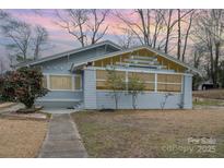 Charming craftsman-style home showcasing its inviting front porch, mature landscaping, and well-maintained exterior at 422 Lee Ave, Wadesboro, NC 28170