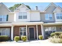 Charming townhouse with a brick facade, covered porch, and well-maintained landscaping at 12742 Spirit Bound Way, Charlotte, NC 28273