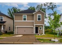Charming two-story home with a welcoming front porch, well manicured lawn, and attached garage in a nice community at 2131 Belterra Dr, Charlotte, NC 28216