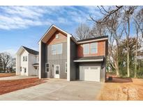 Modern two-story home with mixed siding and attached one-car garage, new construction at 2751 Bradford St, Gastonia, NC 28052