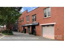 This is the exterior of a red brick commercial building with a mix of office and warehouse spaces at 120 B E Innes St, Salisbury, NC 28144