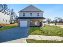 Charming two-story home with brick facade, attached garage and well-manicured lawn at 1540 Solitude Ct, Kannapolis, NC 28081