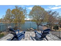A tranquil balcony view showcases the serene waterfront setting and inviting outdoor space at 17701 Springwinds Dr, Cornelius, NC 28031