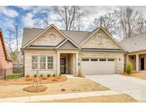 Charming one-story brick home with a two-car garage and manicured front lawn at 333 Lifestyle Ct, Cramerton, NC 28056