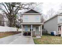 Charming two-story home with stone accents and a welcoming front porch, enhancing curb appeal at 1766 15Th Street Ne Pl, Hickory, NC 28601