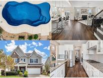 Aerial view of a sparkling in-ground pool with stone landscaping and concrete surround at 2033 Folkstone Ln, Lancaster, SC 29720
