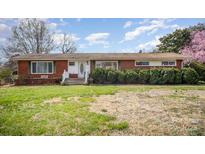 Charming brick ranch-style home with a well-manicured front yard and inviting entrance at 5485 S Nc 16 Hwy, Maiden, NC 28650