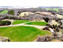 Expansive property featuring verdant green fields and scattered trees, offering a serene, rural landscape at 5534 Little Mountain Rd, Catawba, NC 28609