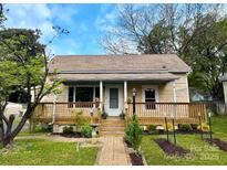 Charming single-story home with a lovely front porch and manicured lawn at 108 Jackson St, Fort Mill, SC 29715