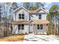 Charming two-story home with gray siding, brown roof, and inviting front entrance at 2206 Hillcrest Ave, Albemarle, NC 28001