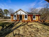Charming single story home with brick facade, white trim, and a well-maintained lawn on a sunny day at 4808 Cedar Ct, Gastonia, NC 28056