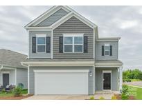Charming two-story home with a gray exterior, black shutters, white trim, and a two-car garage at 1101 Red River Dr, Salisbury, NC 28144