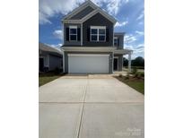 Charming two-story home featuring a two-car garage and a well-manicured lawn at 1101 Red River Dr, Salisbury, NC 28144