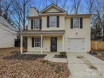 Charming two-story home with a well-maintained lawn and attached garage at 1411 Swaying Branch Ln, Clover, SC 29710