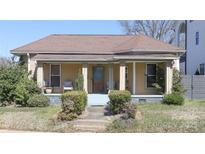 Charming single-story home with a welcoming front porch and well-maintained landscaping at 1001 Parkwood Ave, Charlotte, NC 28205