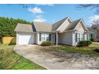 Charming single-story home with a well-manicured lawn, driveway, and attached one-car garage at 2007 Wexford Way, Statesville, NC 28625