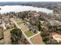Expansive lakefront property with mature trees, lush lawns, and water access at 2200 Peninsula Ave, Shelby, NC 28150