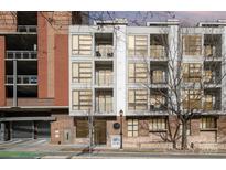 Modern condo building with large windows and balconies, offering city views and contemporary design at 525 E Sixth St # 208, Charlotte, NC 28202