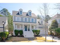 Charming two-story home with a welcoming front porch and beautiful landscaping at 875 Stratford Run Dr, Fort Mill, SC 29708
