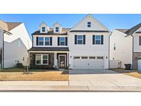 Charming two-story home with black shutters, neutral siding, and a two-car garage at 838 Foxglove Ln, York, SC 29745