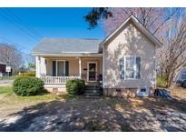 Charming single-story home features a cozy front porch and traditional architectural details at 201 Marion St, Clover, SC 29710
