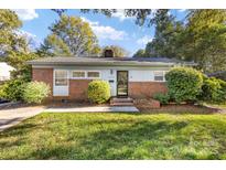 Charming one-story home with brick accents and mature landscaping at 4635 General Pershing Dr, Charlotte, NC 28209