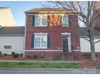 Charming brick two-story home with black shutters and landscaped front yard at 508 Summerfield Pl, Belmont, NC 28012