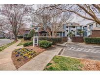 View of the exterior of a multi-Gathering complex with manicured landscaping at 623 Olmsted Park Pl # D, Charlotte, NC 28203